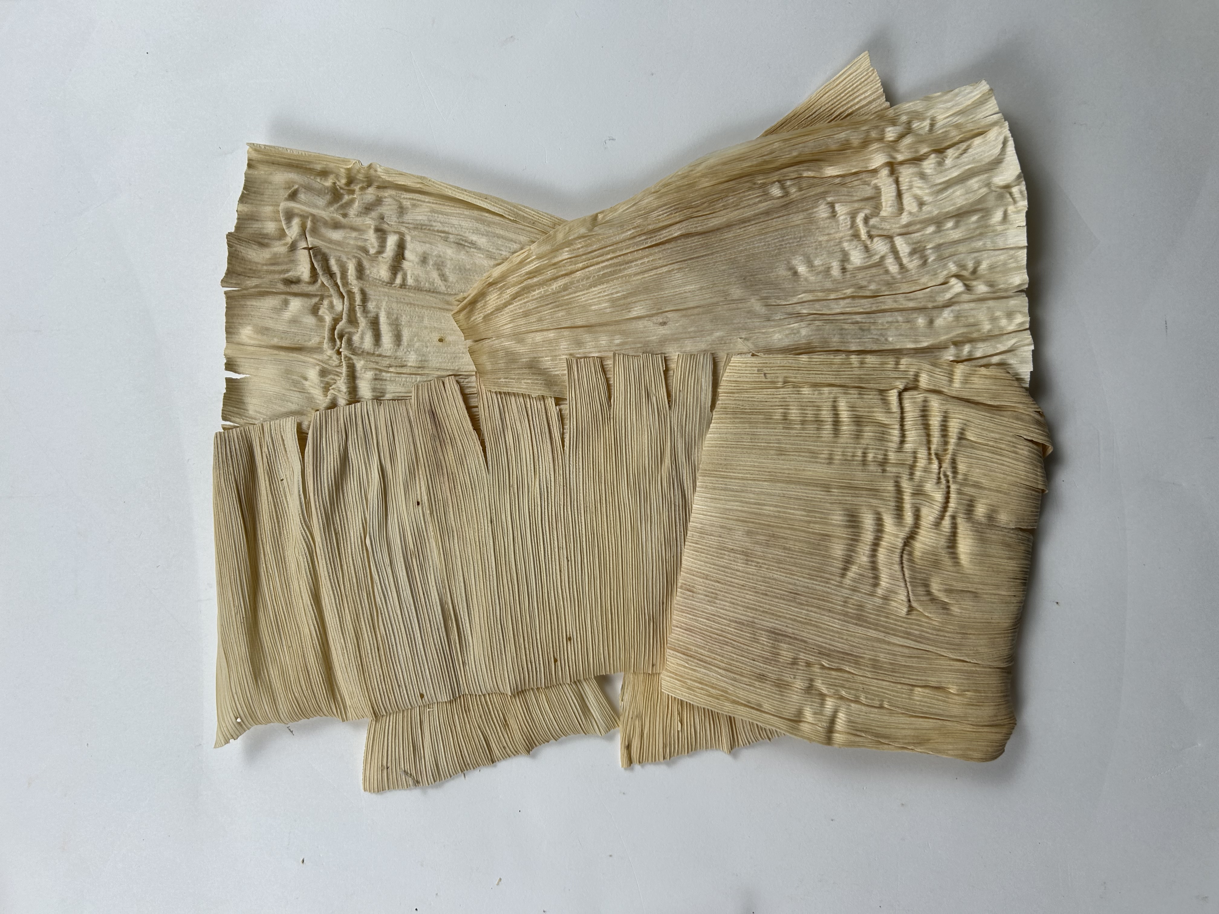 Corn husk sheets bound together
